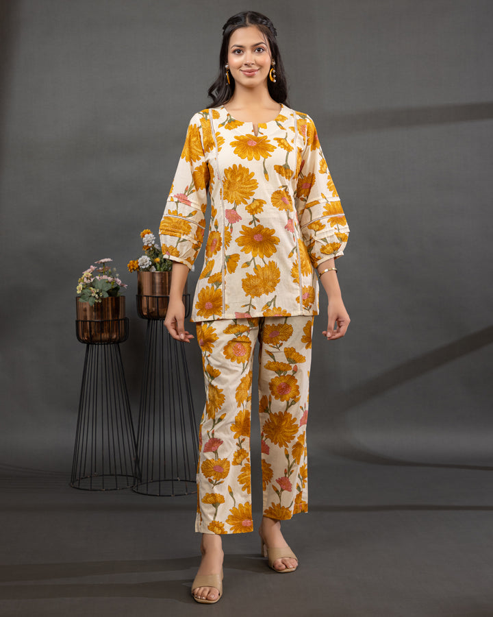Sunaya Bloom Cotton Co-ord Set with beige base, orange floral print, and lace detailing